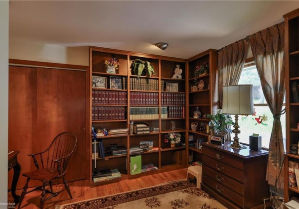 Library/Study with built in bookcases and hardwood floor