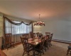 Formal Dining area with built-in corner cabinets and hardwood floors