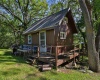 Cabin on the grounds with loft bedroom and living area; electricity