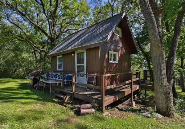 Cabin on the grounds with loft bedroom and living area; electricity