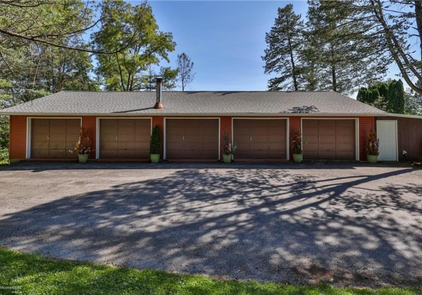 2 Story garage with five bays on main level and small workshop