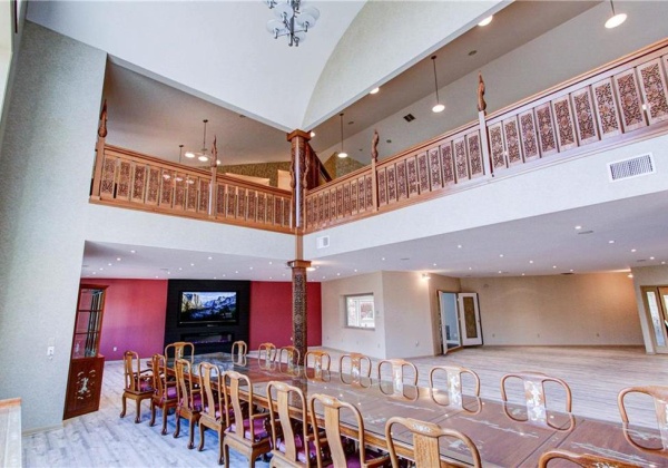 Intricately hand carved wooden railings on the second floor