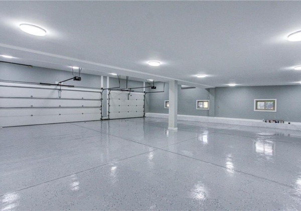 Extra large attached garage, could fit six cars, well insulated, new wifi openers, new 24000 BTU mini-split (heat & cold). New epoxy flooring, new LED lighting, plenty of electric for EV charging possibilities