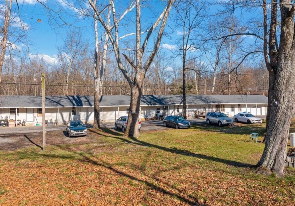 Converted motel with plenty of off street parking.