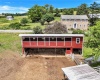 back of 2nd building w/ loafing shed across from house