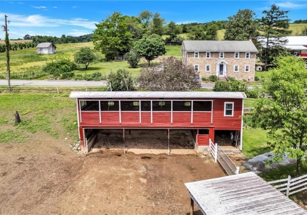 back of 2nd building w/ loafing shed across from house