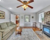 living room w/ wood stove & random width floors