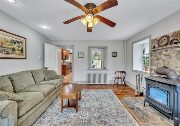 living room w/ wood stove & random width floors