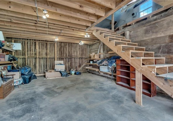 stairs in outbuilding lead up to loft