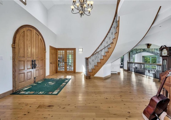 French doors off of foyer lead to sunken office/studio