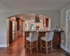 bar overhang seating area with view of Kitchen