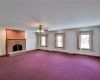 Family room with woodburning fireplace