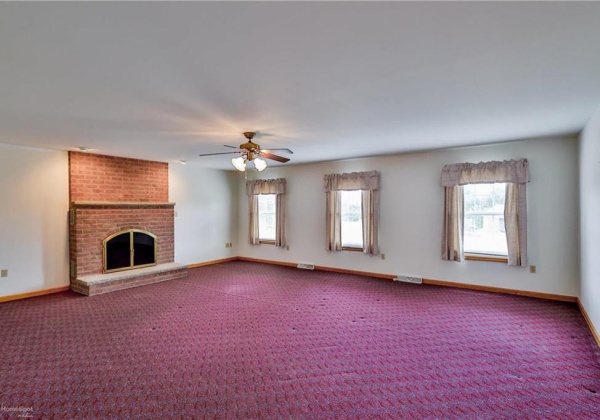 Family room with woodburning fireplace