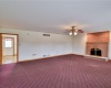 Family room with woodburning fireplace