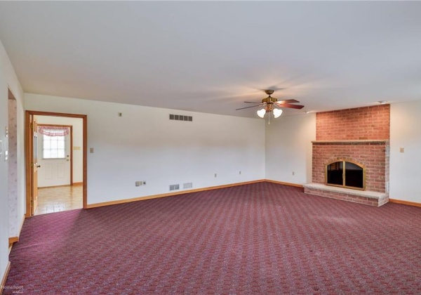 Family room with woodburning fireplace