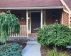 Concrete entrance with tiled balcony