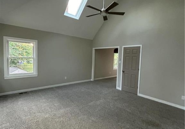 Cathedral ceilings and skylights set off the master bedroom