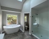 En suite master bathroom with skylight and cathedral ceilings