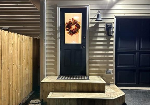 Entering through the side door leading to a mudroom complete with washer and dryer hook up