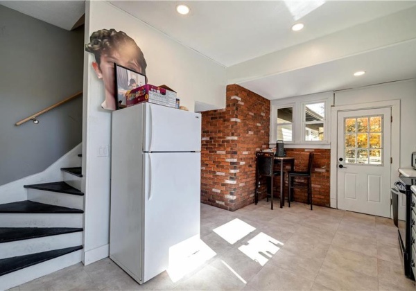 Kitchen w/ Butler Staircase