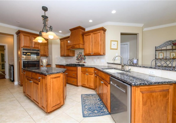 Kitchen with center island and two-tier countertop with seating