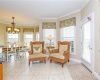 Sitting area in kitchen with doors to deck