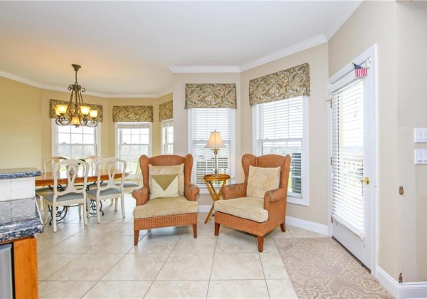 Sitting area in kitchen with doors to deck