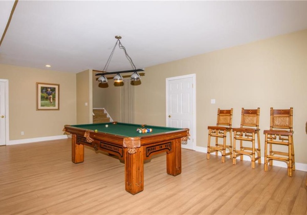 Walk-out lower level recreational room with additional living quarters