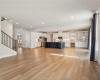 Open concept Family room view to kitchen and eating area accessible to outdoor covered porch.