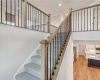 Stairs to second floor with open loft at arrival