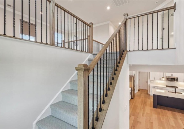 Stairs to second floor with open loft at arrival