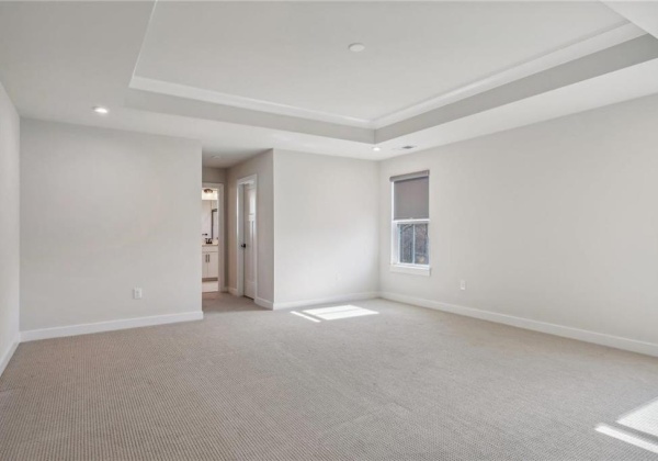 Primary ensuite with two walk-in closets