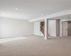 Family room in lower level with entrance to media room/exercise room via double doors.