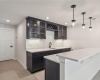 Lower level wet bar with built in wine refrigerator