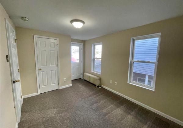 Bedroom one, closet space with natural light - deck acces