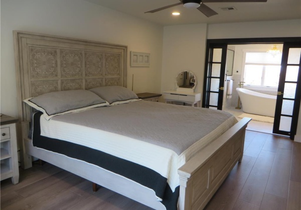 Owner's bedroom with view of en suite bathroom