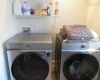 Laundry room has large storage closet