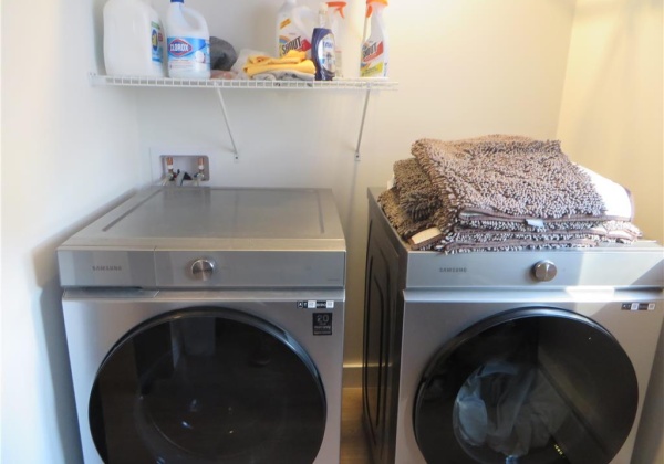 Laundry room has large storage closet