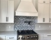 Proper gas stove and range hood with pot filler and backsplash