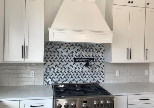 Proper gas stove and range hood with pot filler and backsplash