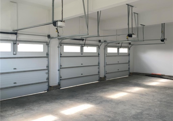 Insulated garage doors with openers