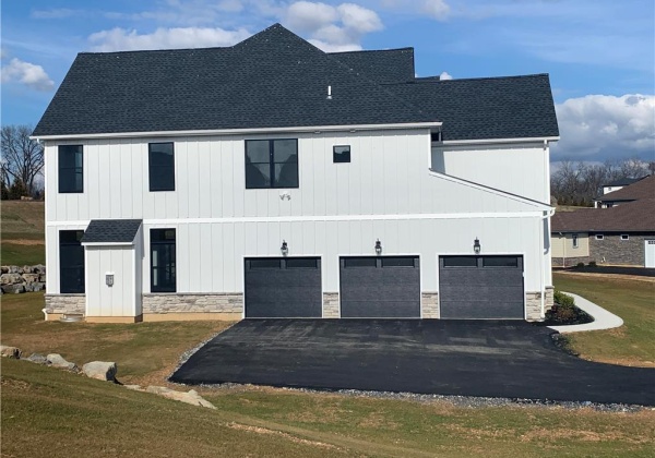 Side elevation shows depth of home