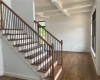 Looking into living room with transom windows and coffered ceiling