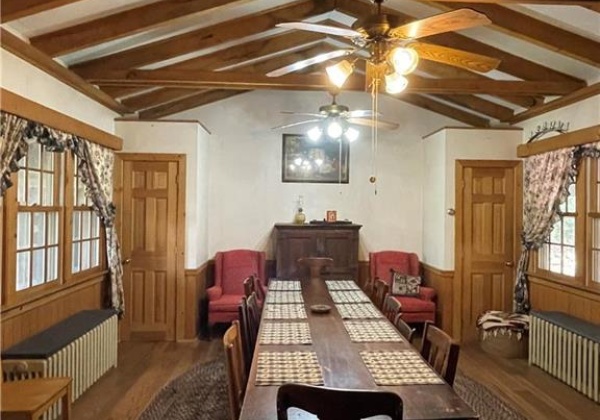 Dining room with matching cedar coat closets.