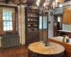 Kitchen with eat-in space and charming chandelier and exposed beams.