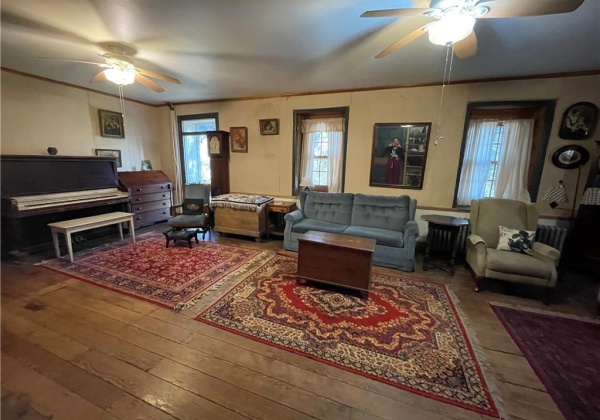 Spacious living room with plenty of natural light from all the windows.