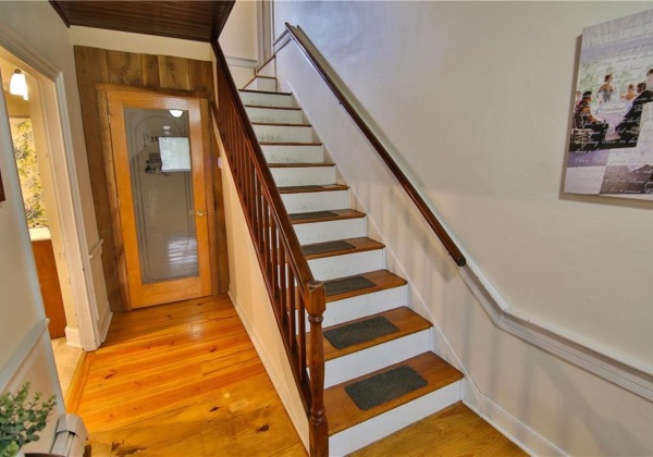 Wide hallway leads to 1st floor full bathroom