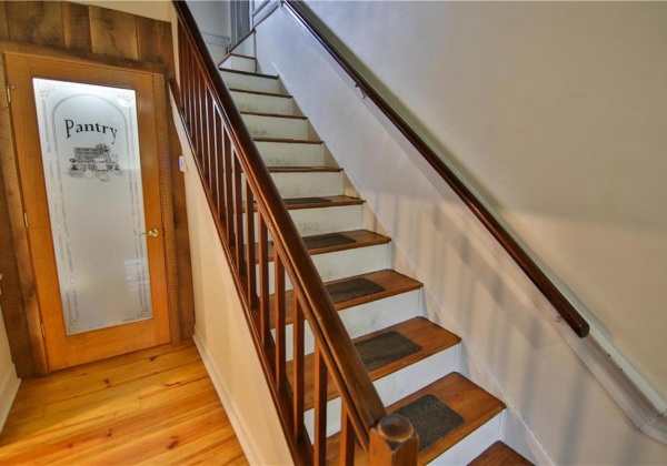 Wide staircase & beautiful new pantry offers tons of storage