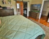 Another view of primary bedroom to hallway