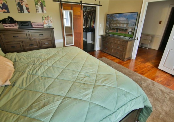 Another view of primary bedroom to hallway